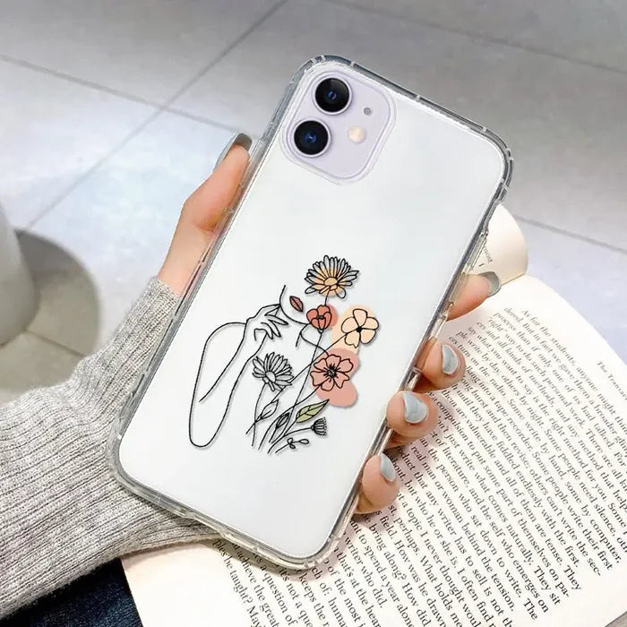 a woman holding a flower phone case