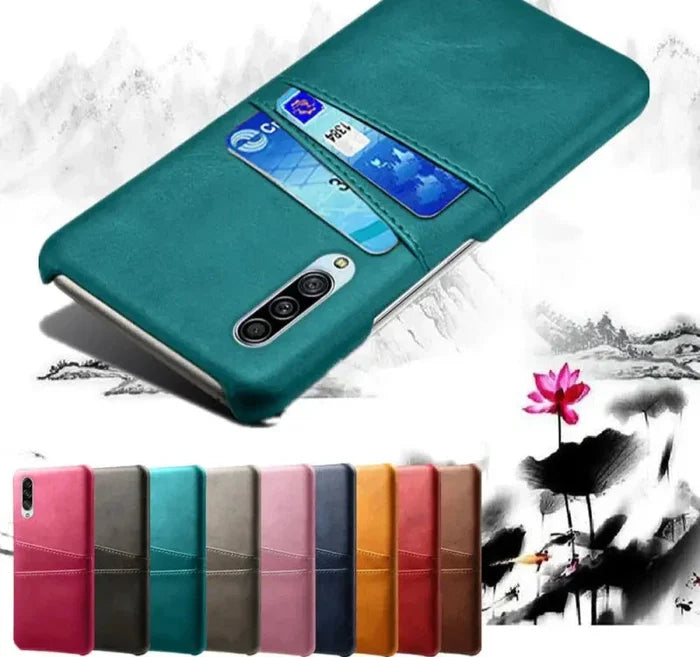 a close up of a phone case with a flower in the background