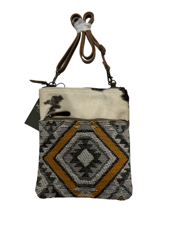 myra yellow and black cowhide canvas cross body  bag with tooled leather.