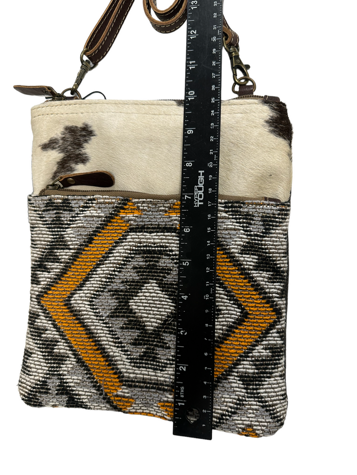 myra yellow and black cowhide canvas cross body  bag with tooled leather.