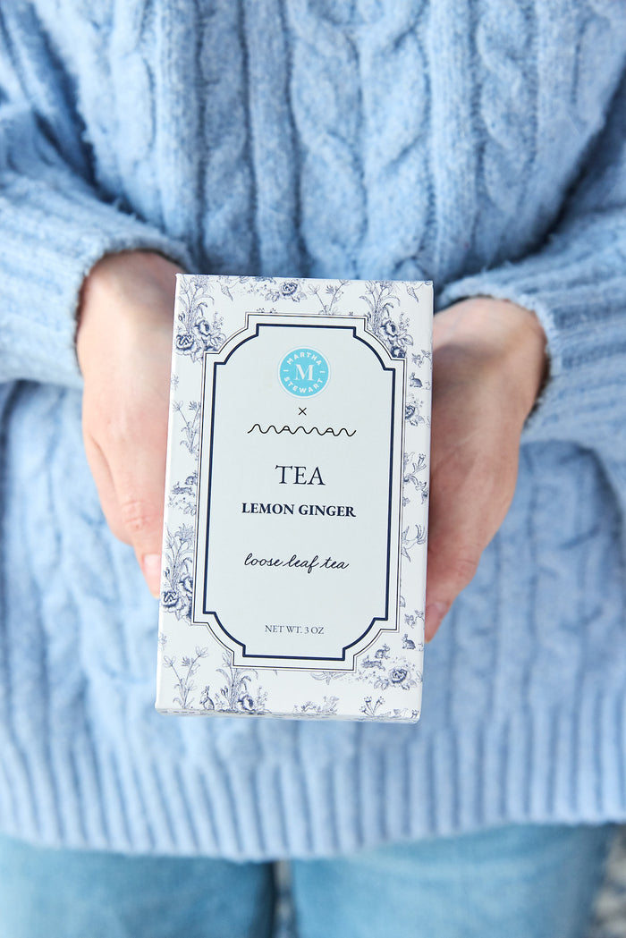 Person holding a box of lemon ginger tea from the Martha Stewart x maman collection.
