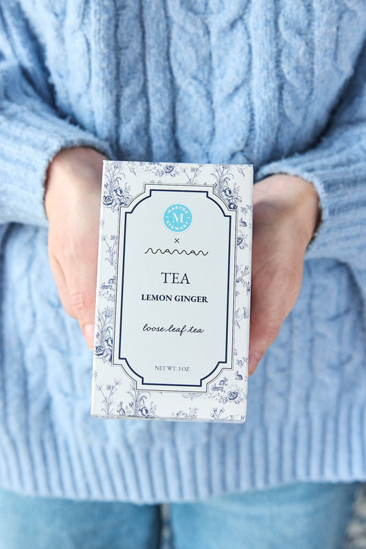 Person holding a box of lemon ginger tea from the Martha Stewart x maman collection.
